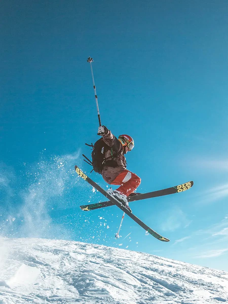 A skier carving fresh powder at Winter Park Resort