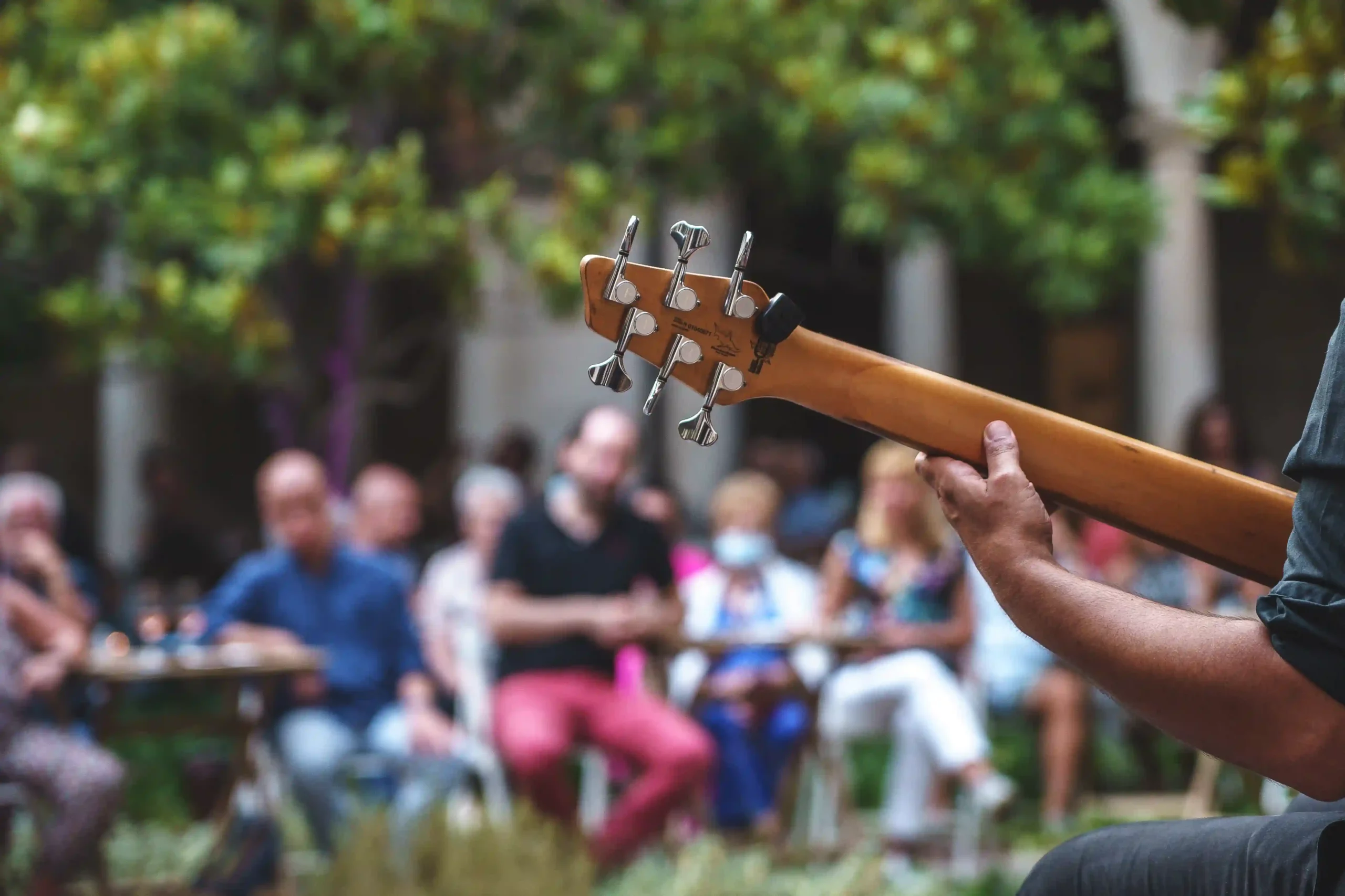 A live band playing on an outdoor patio in the mountains